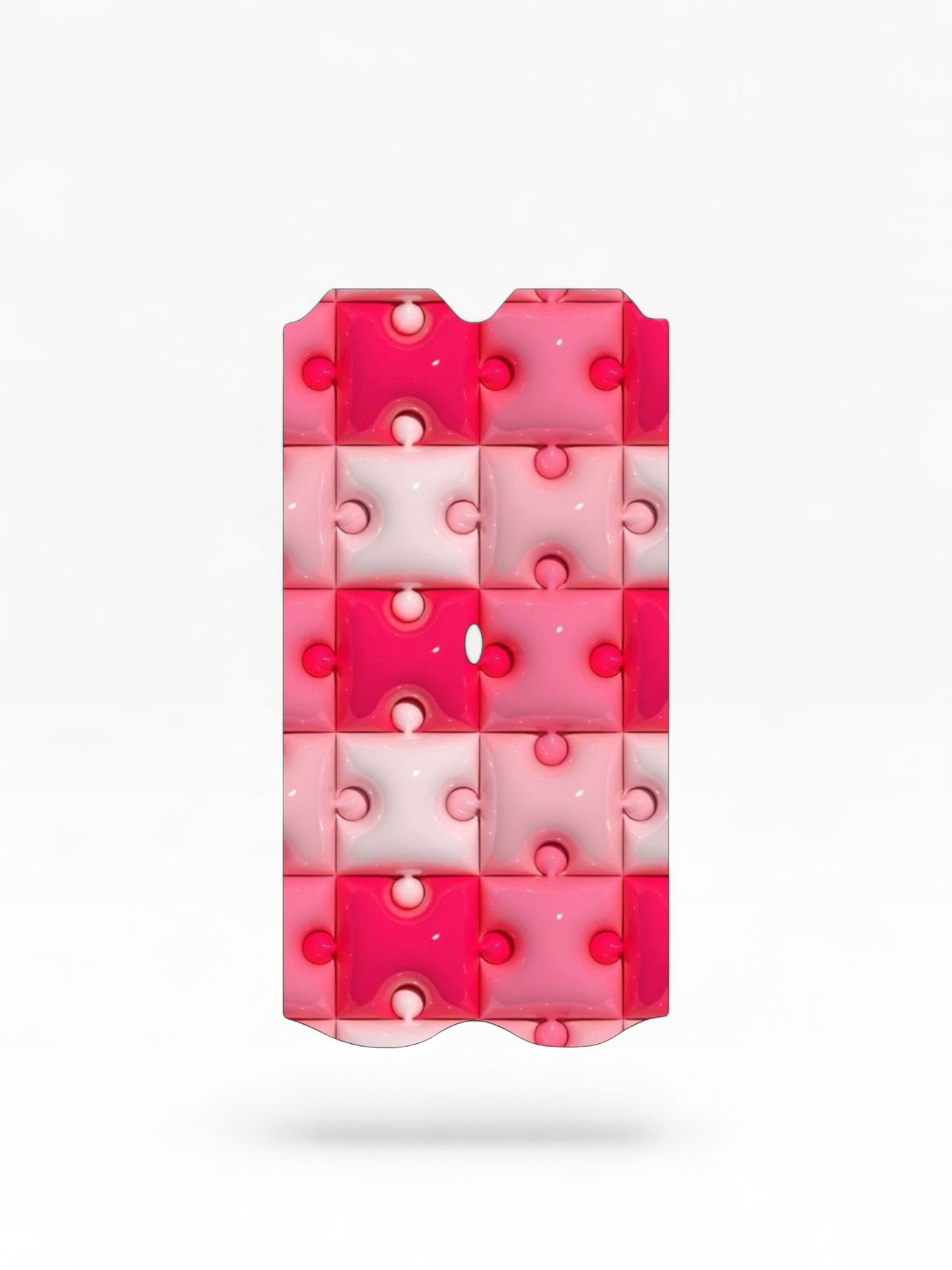 Cloud Skinz waterproof Vuse Alto decal featuring a glossy pink and white puzzle piece pattern.
