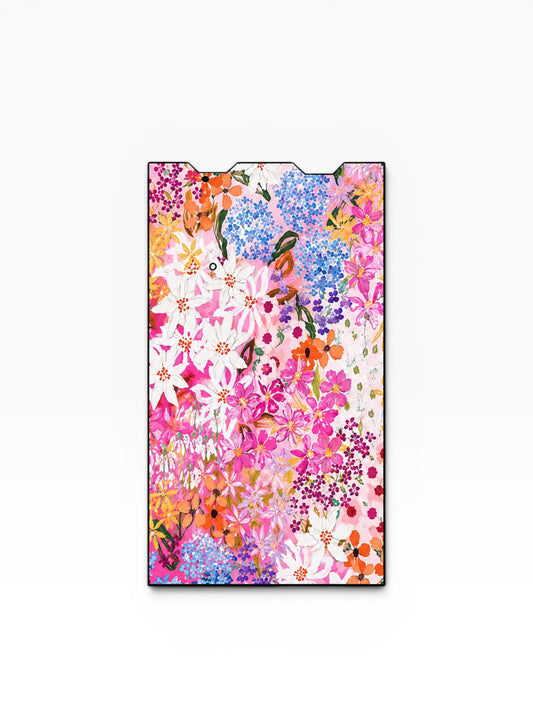 Cloud Skinz waterproof vinyl Juul vape decal featuring a vibrant floral pattern with pink, orange, and blue flowers.