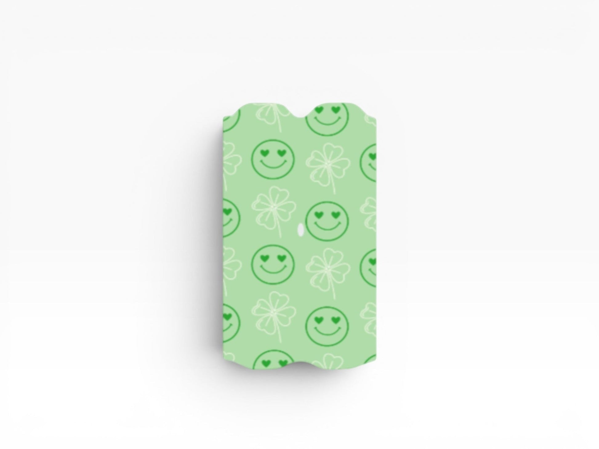 Cloud Skinz green vape wrap featuring a playful pattern of heart-eyed smiley faces and white four-leaf clovers.