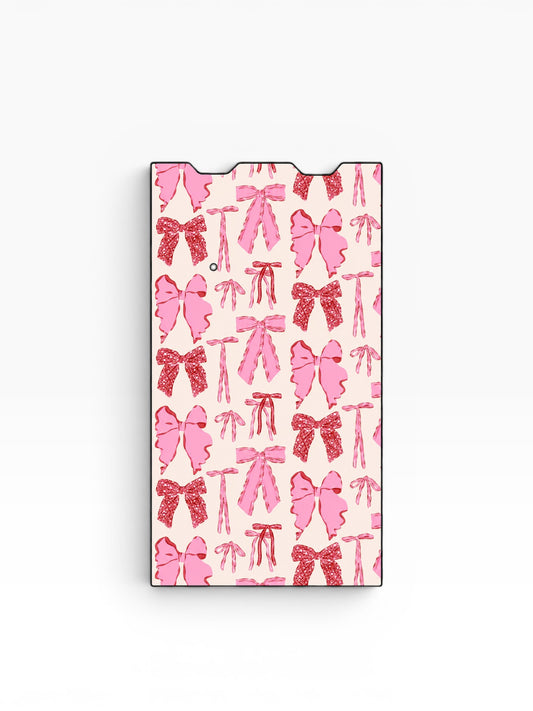 Cloud Skinz waterproof vinyl Juul vape decal featuring a repeating pattern of pink bows on a light pink background.