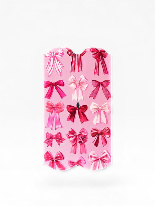 Cloud Skinz pink coquette bow vinyl wrap for Vuse Alto featuring various ribbon designs on a soft blush background.