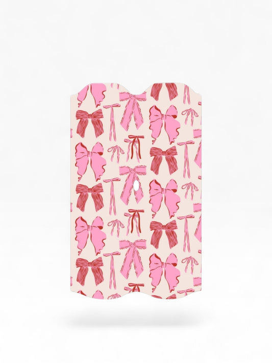 Cloud Skinz waterproof Vuse Alto decal featuring a cute pink and red bow pattern on a light background