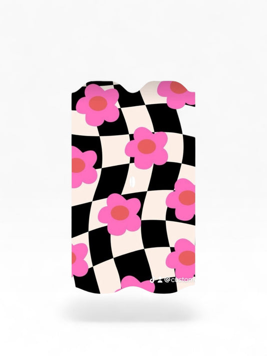 Cloud Skinz waterproof decal for Vuse Alto featuring a black and white checkered pattern with pink flower accents.