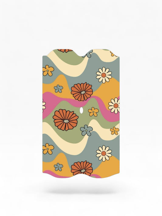 Cloud Skinz waterproof Vuse Alto decal featuring a retro 70s wavy floral pattern in orange, green, and pink.