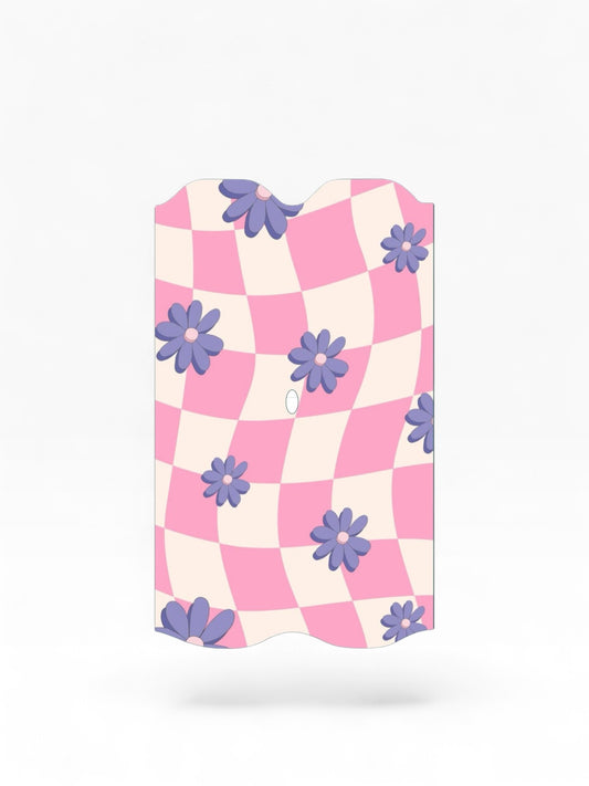 Cloud Skinz waterproof Vuse Alto decal featuring a pink and white checkered pattern with purple flower accents.