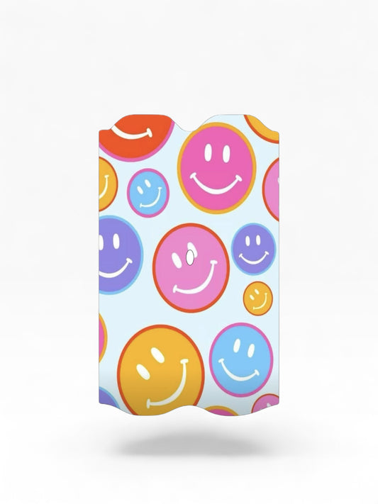 Cloud Skinz waterproof Vuse Alto decal featuring a colorful happy face pattern on a light blue background