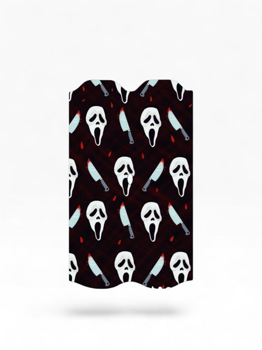 Cloud Skinz waterproof Vuse Alto decal featuring a horror-themed pattern with ghost masks and bloody knives.