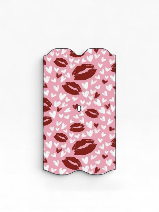 Cloud Skinz waterproof Vuse Alto decal featuring a pink background with red lipstick kiss marks and white hearts.