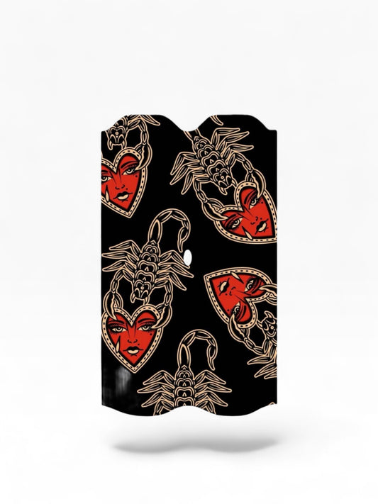 Cloud Skinz waterproof Vuse Alto decal featuring a black background with red heart-faced scorpion tattoo-style art.