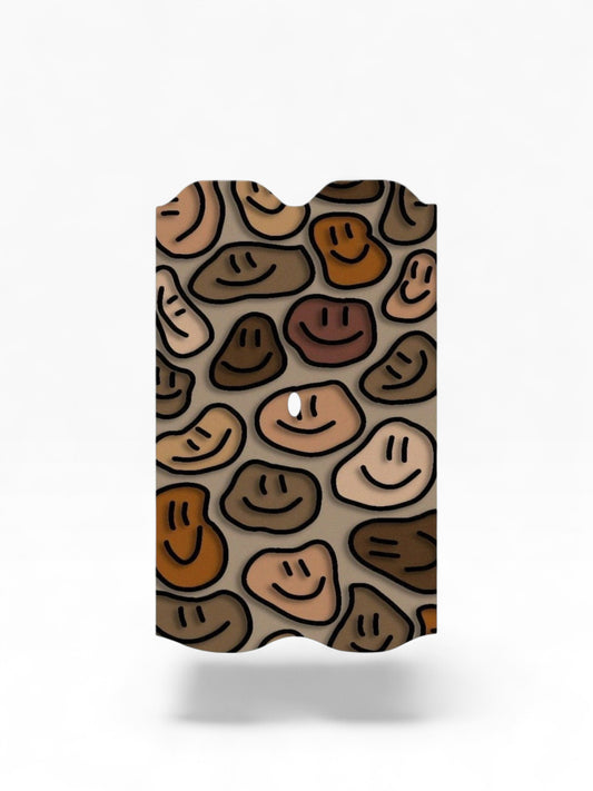 Cloud Skinz waterproof Vuse Alto decal featuring a brown and beige smiley face pattern on a protective vape skin